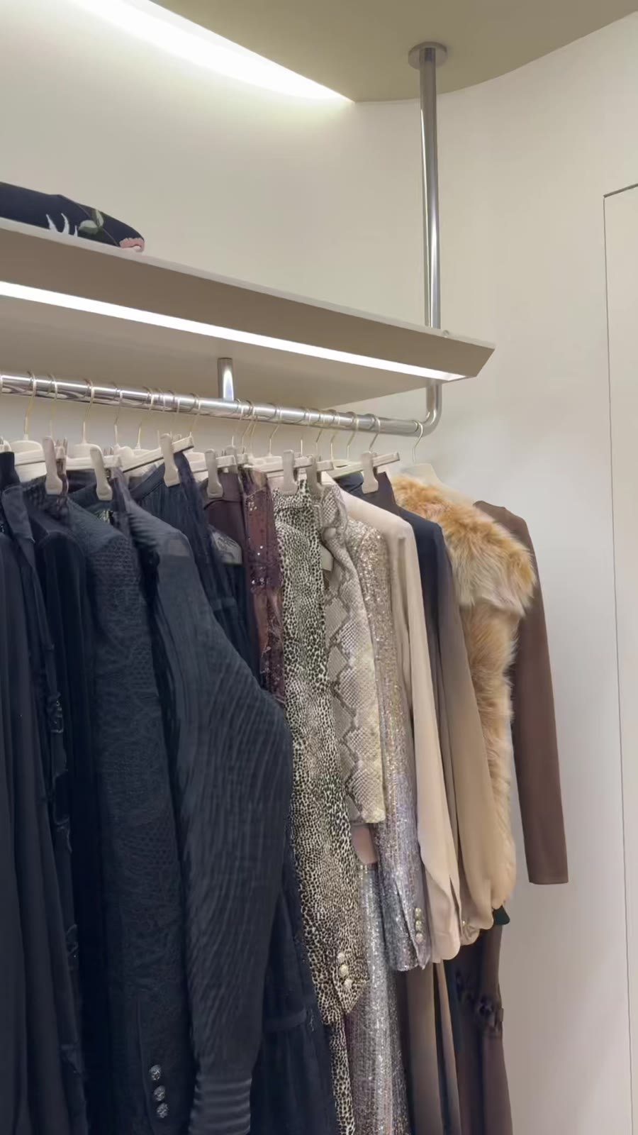 A rail of coats and jackets at the trunk show