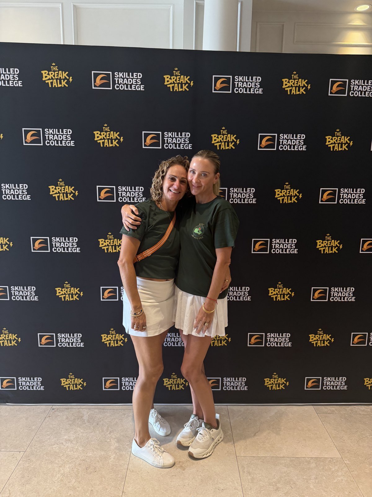 Two foundation supporters at the photo wall